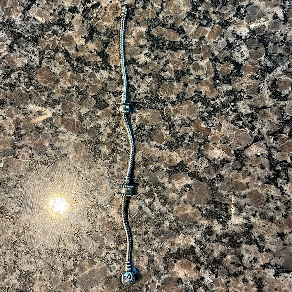 Authentic Pandora bracelet with 2 stoppers.